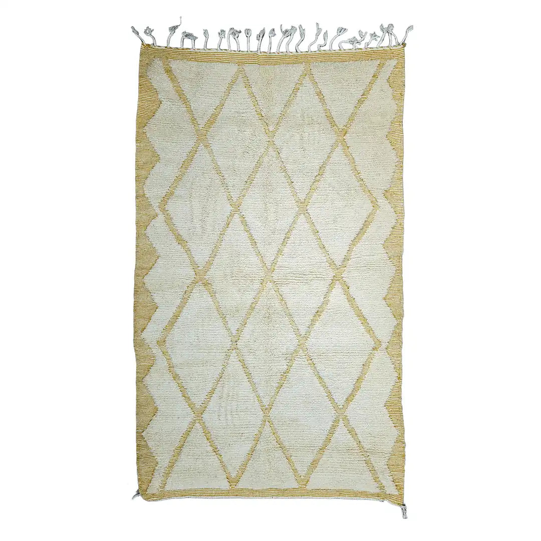 Handwoven Beni Ouarain wool rug featuring soft sand diamond motifs and border details.