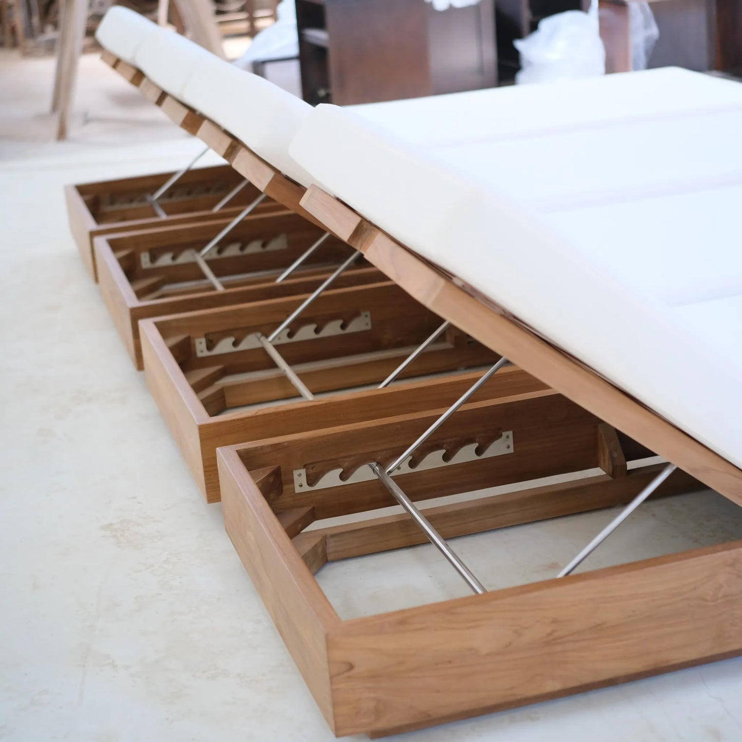 Detailed view of the teak Laguna Sun Bed’s stainless steel adjustable support mechanism and frame construction.