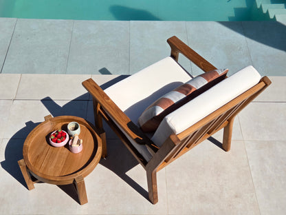 Premium Grade A teak lounge chair with weather-resistant ivory cushions for luxury outdoor mediterranean living.