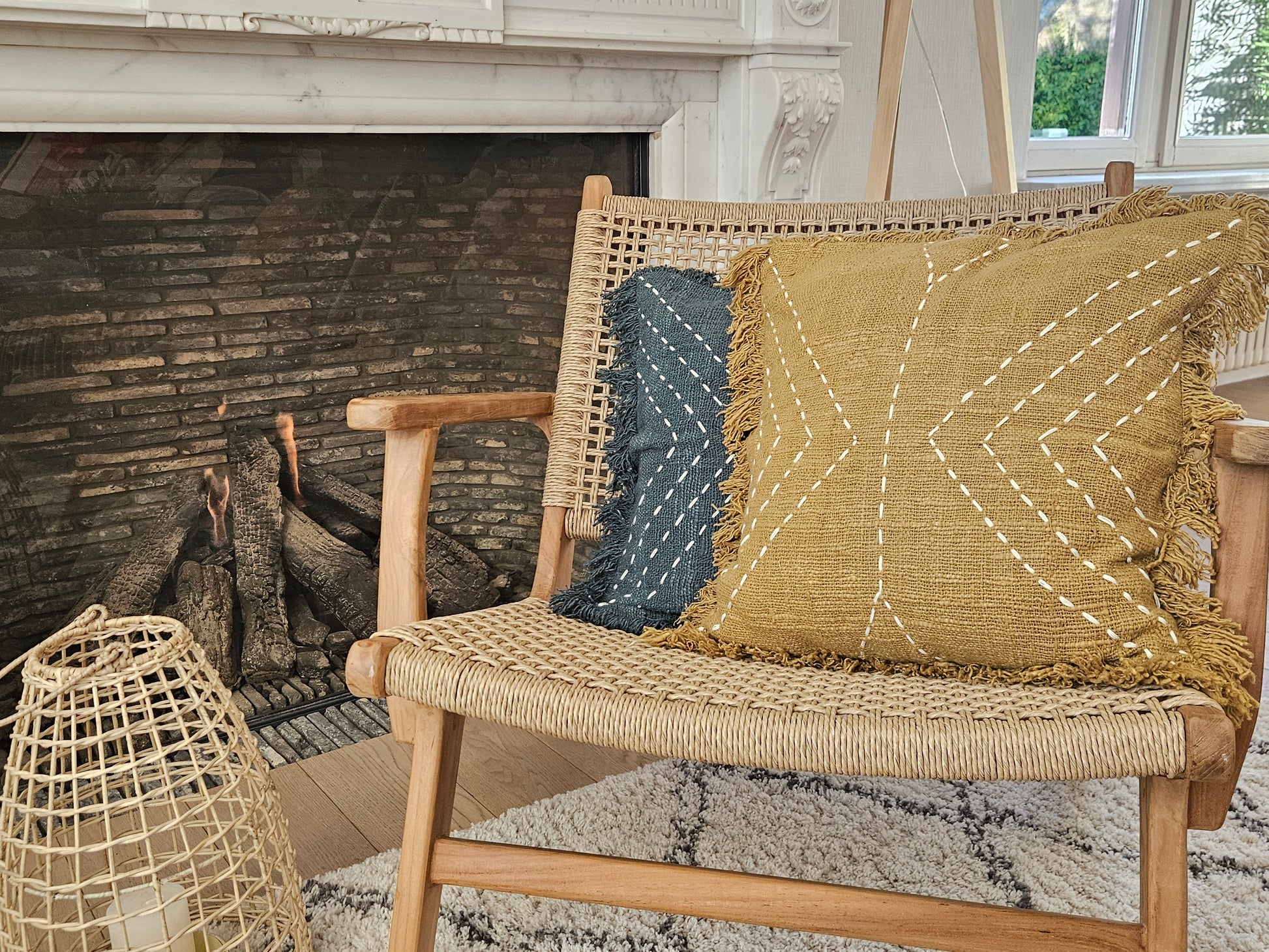 Boho cushions on rattan lounge chair