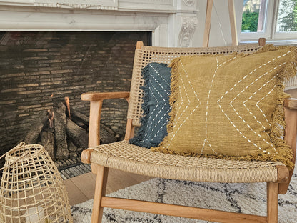 Boho cushions on rattan lounge chair