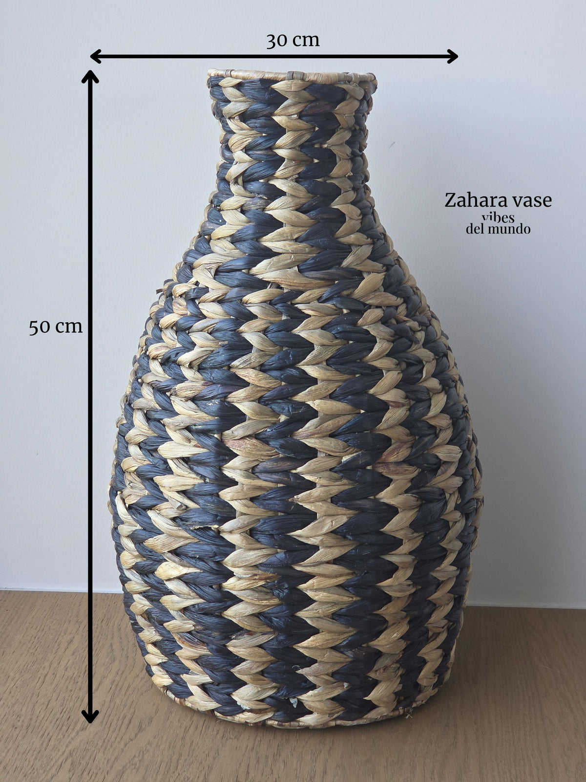 Zahara decorative woven vase in black and natural tones with a geometric zigzag pattern, shown with dimensions of 30 cm wide and 50 cm high