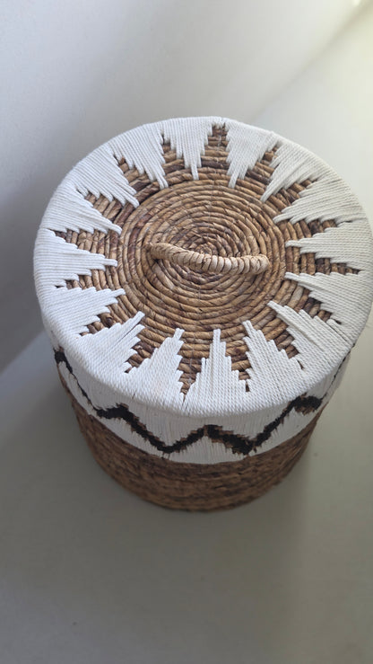 Top view of the Samuel handwoven abaca storage basket with fitted lid and natural rope handle.