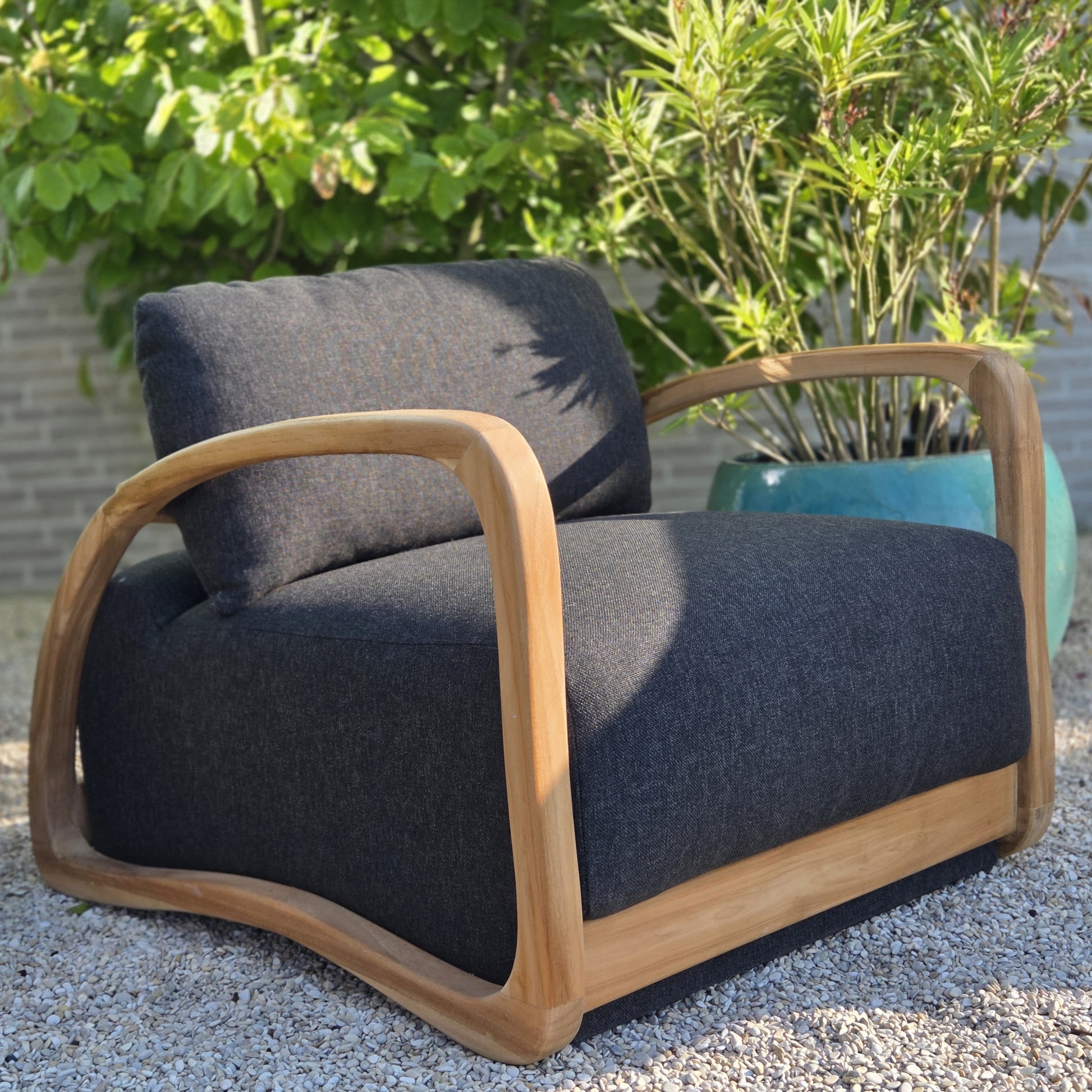Premium Grade A teak outdoor lounge chair with weather-resistant charcoal cushions for stylish garden and terrace living