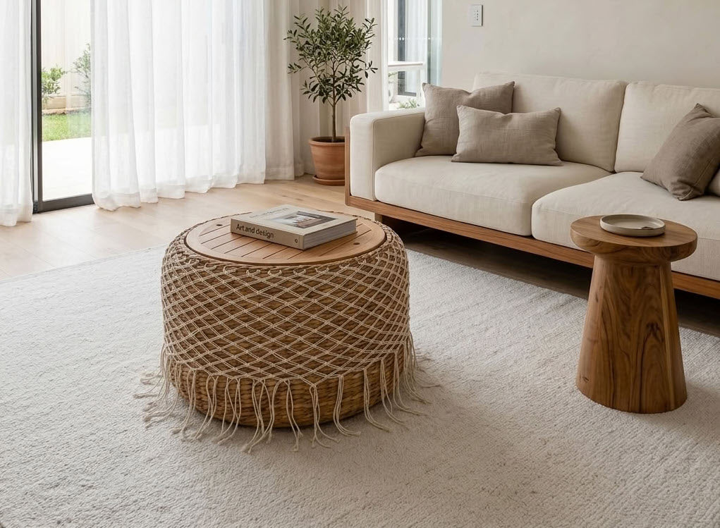 Handcrafted woven coffee table in a bright Scandinavian living room with natural wood furniture.