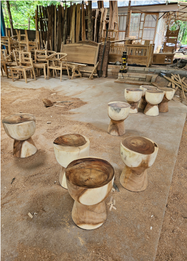 Artisan handcrafting boho furniture using natural materials in a local workshop